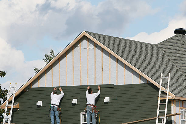 Professional Storm Damage Siding Repair technician working in Chester, VA